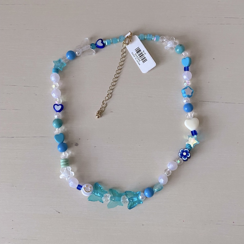 NWT Urban Outfitters blue beaded camp butterfly happy face necklace